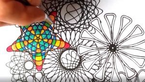 Colouring a page of spirograph designs